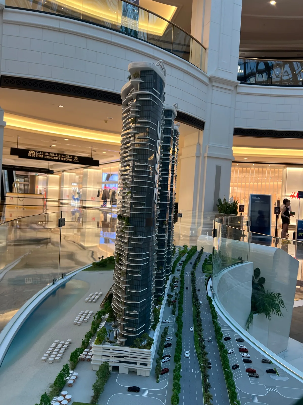 Side profile of a model tower and the curved display enclosure.