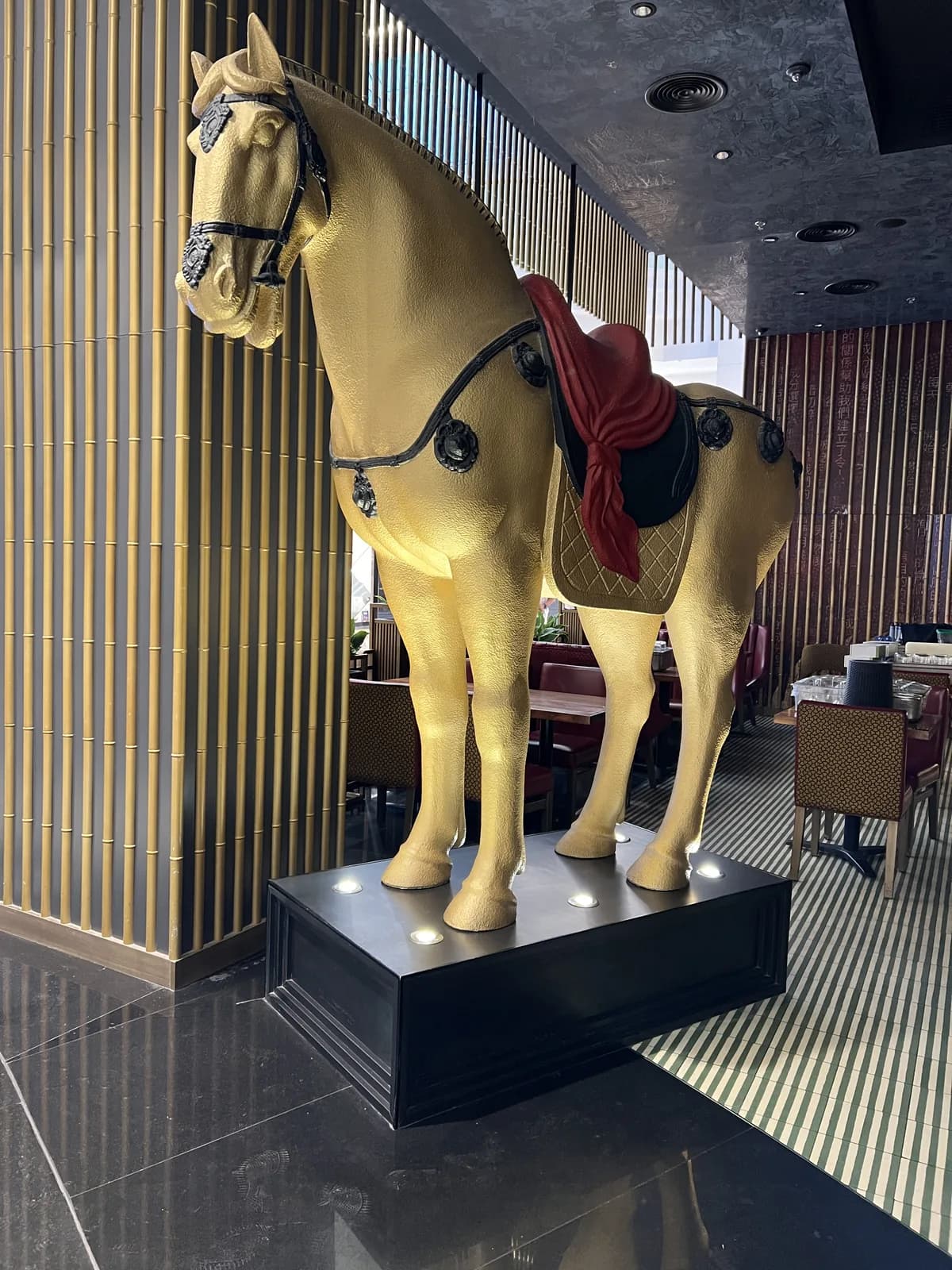 Side view of the decorative horse display in a hospitality interior.