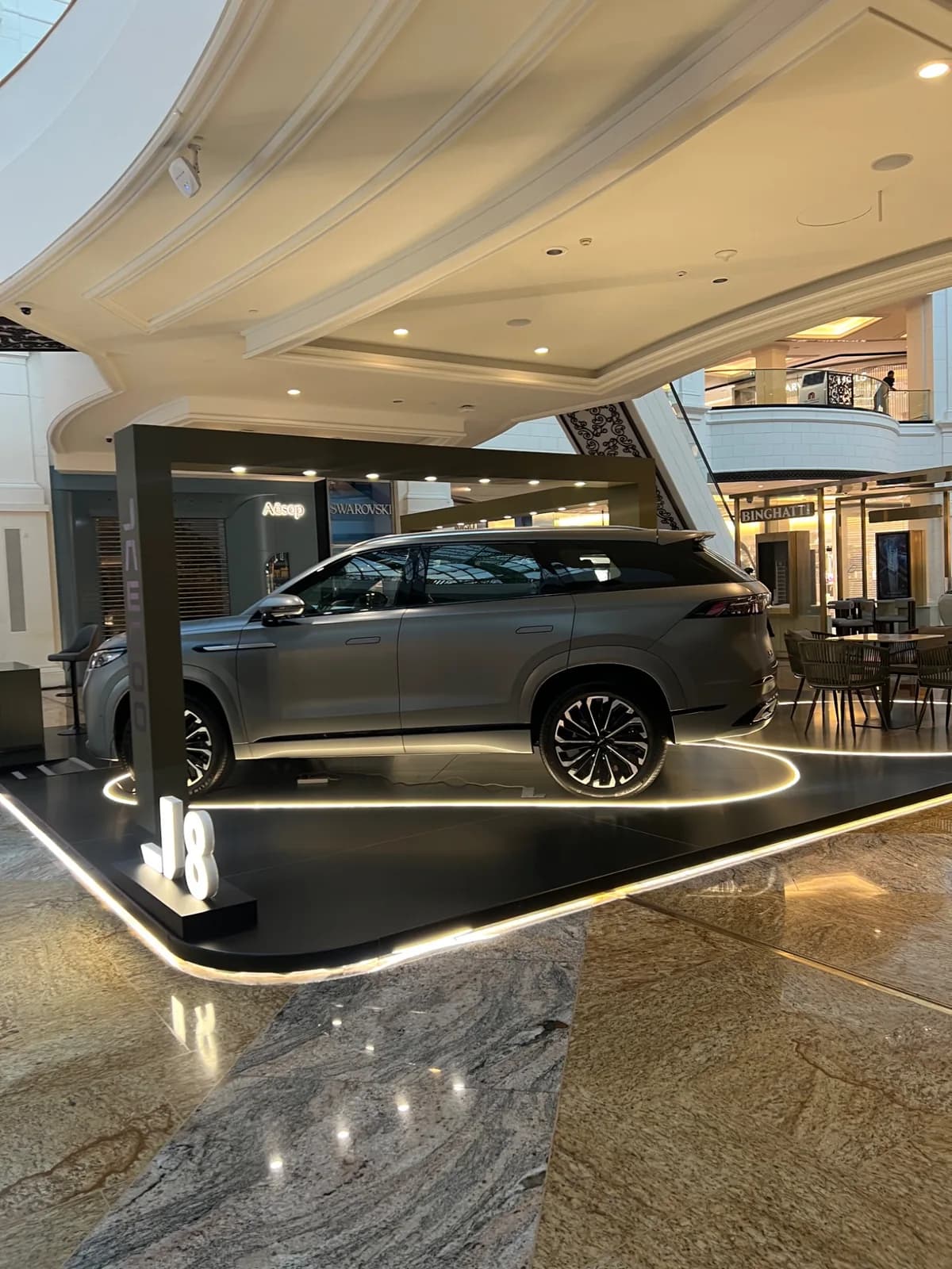 Side angle of the JAECOO mall display and overhead frame.